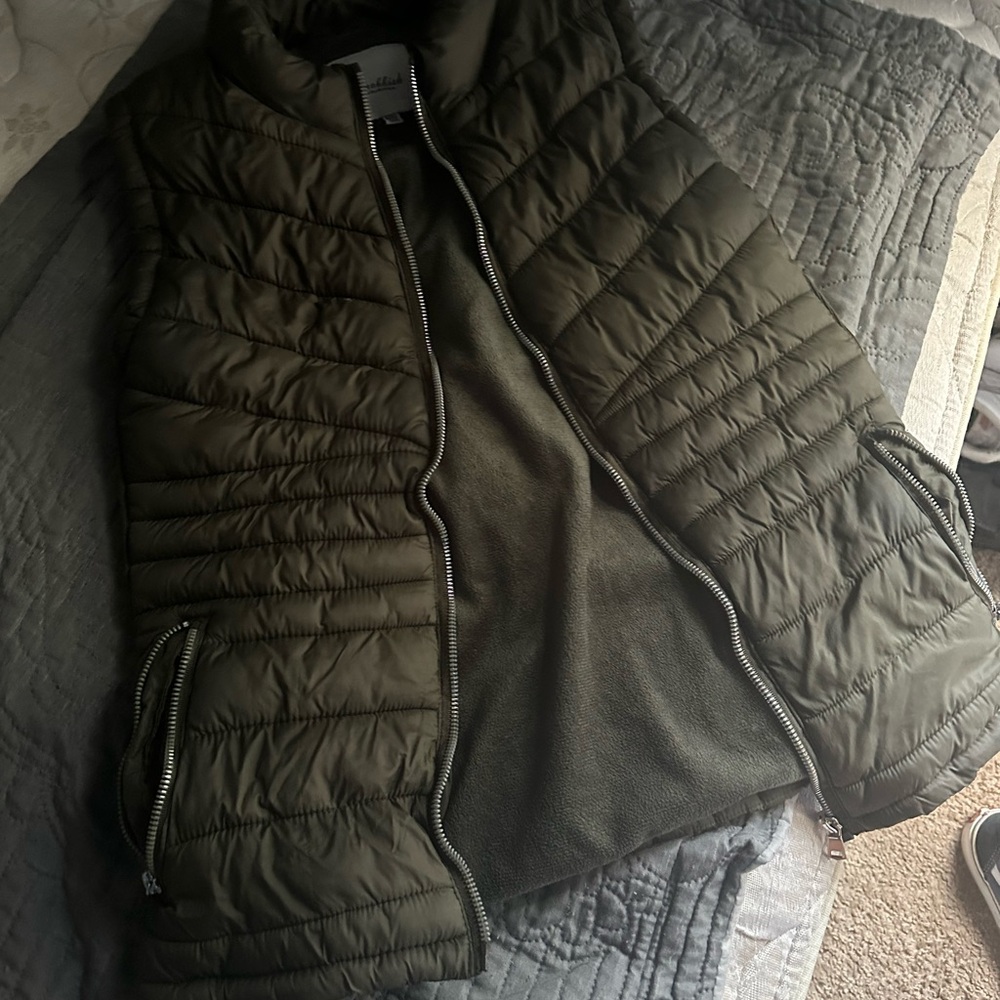 Green sleeveless jacket